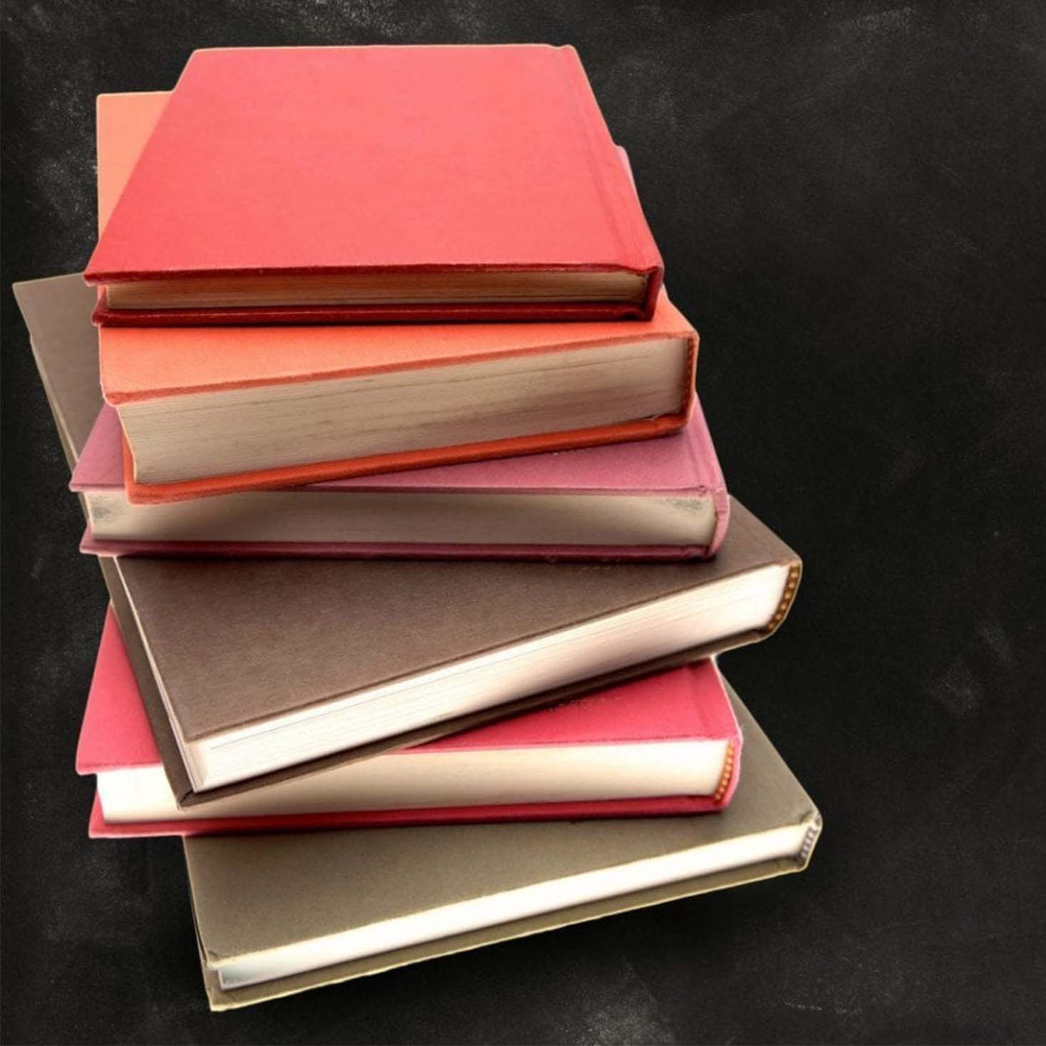 A Black background with stack of books