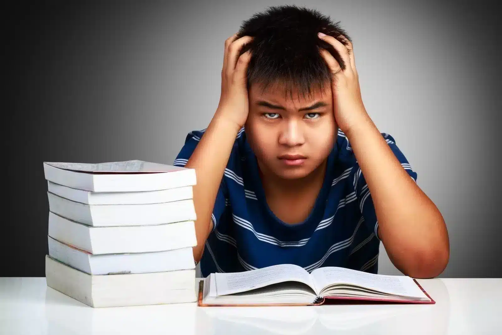 Frustated Boy with Books