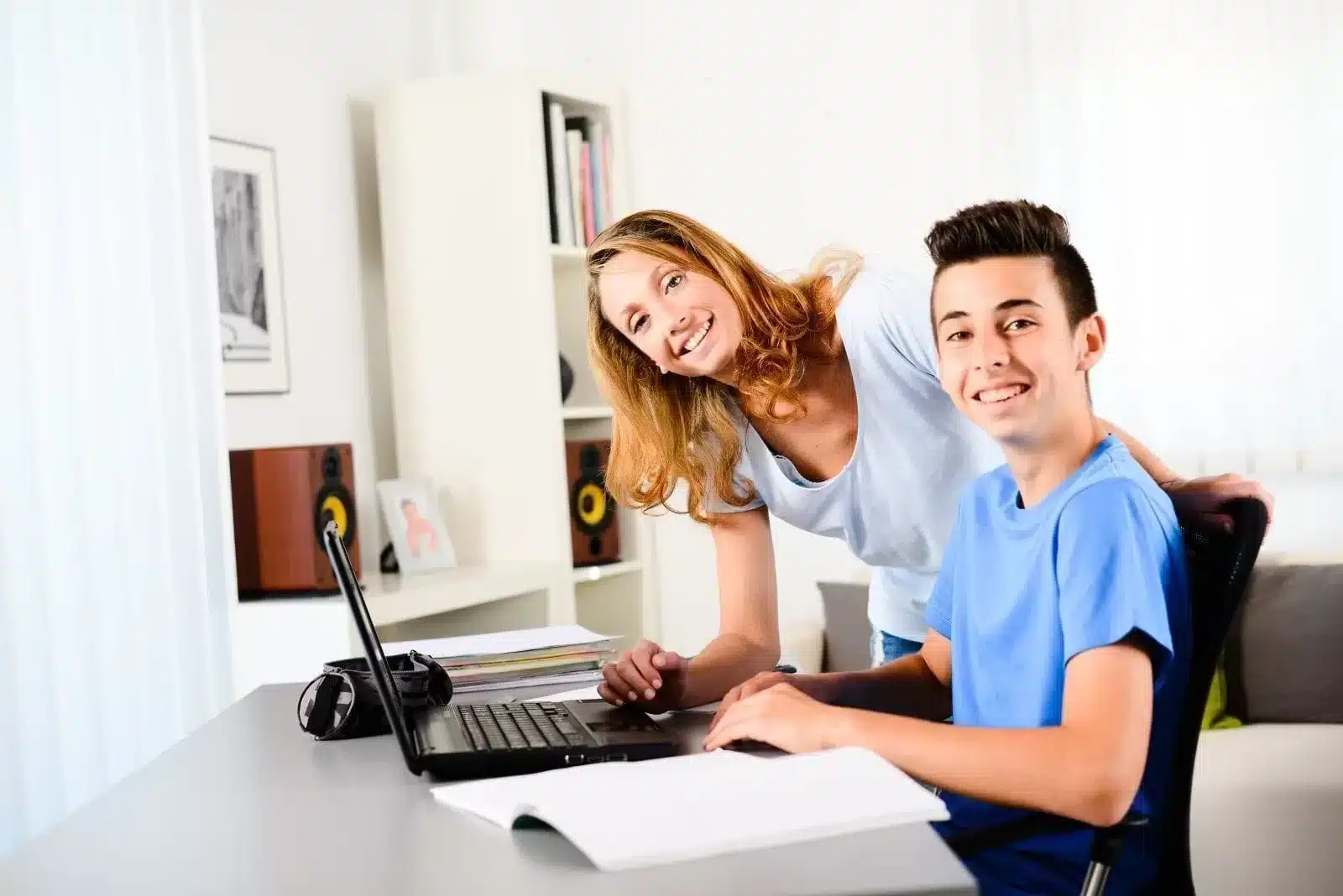 Boy on laptop with mom