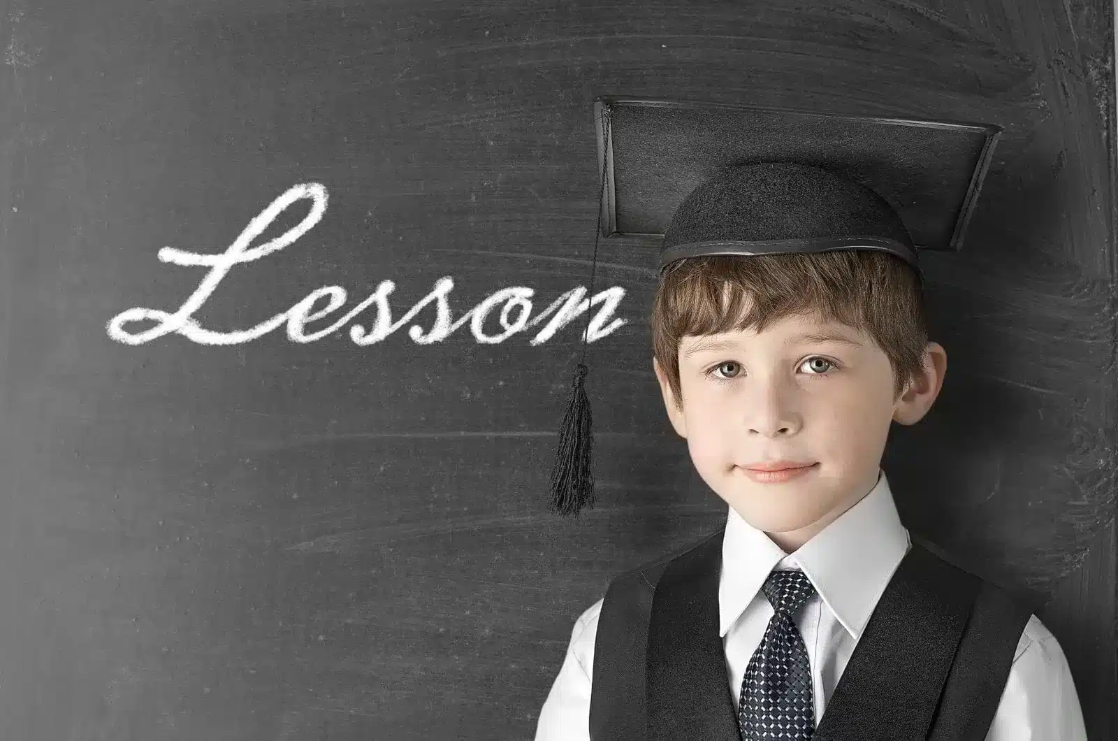 Boy-with-Lesson-written-on-the-chalkboard