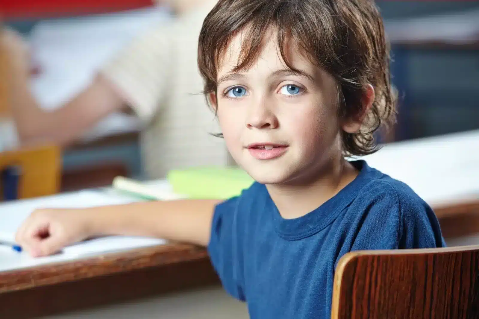 Children with blue eyes do her paper