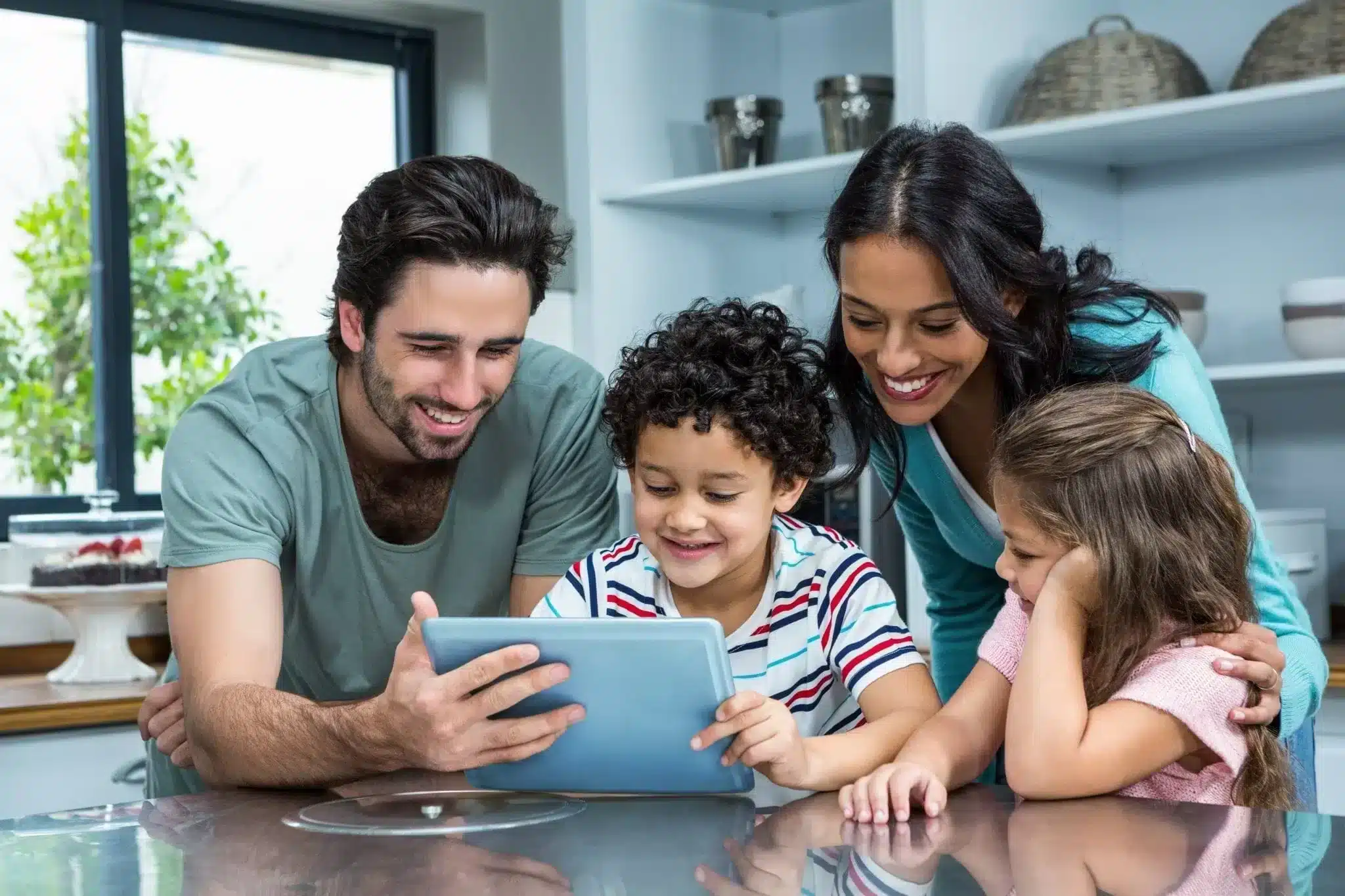 Happy family operating iPad