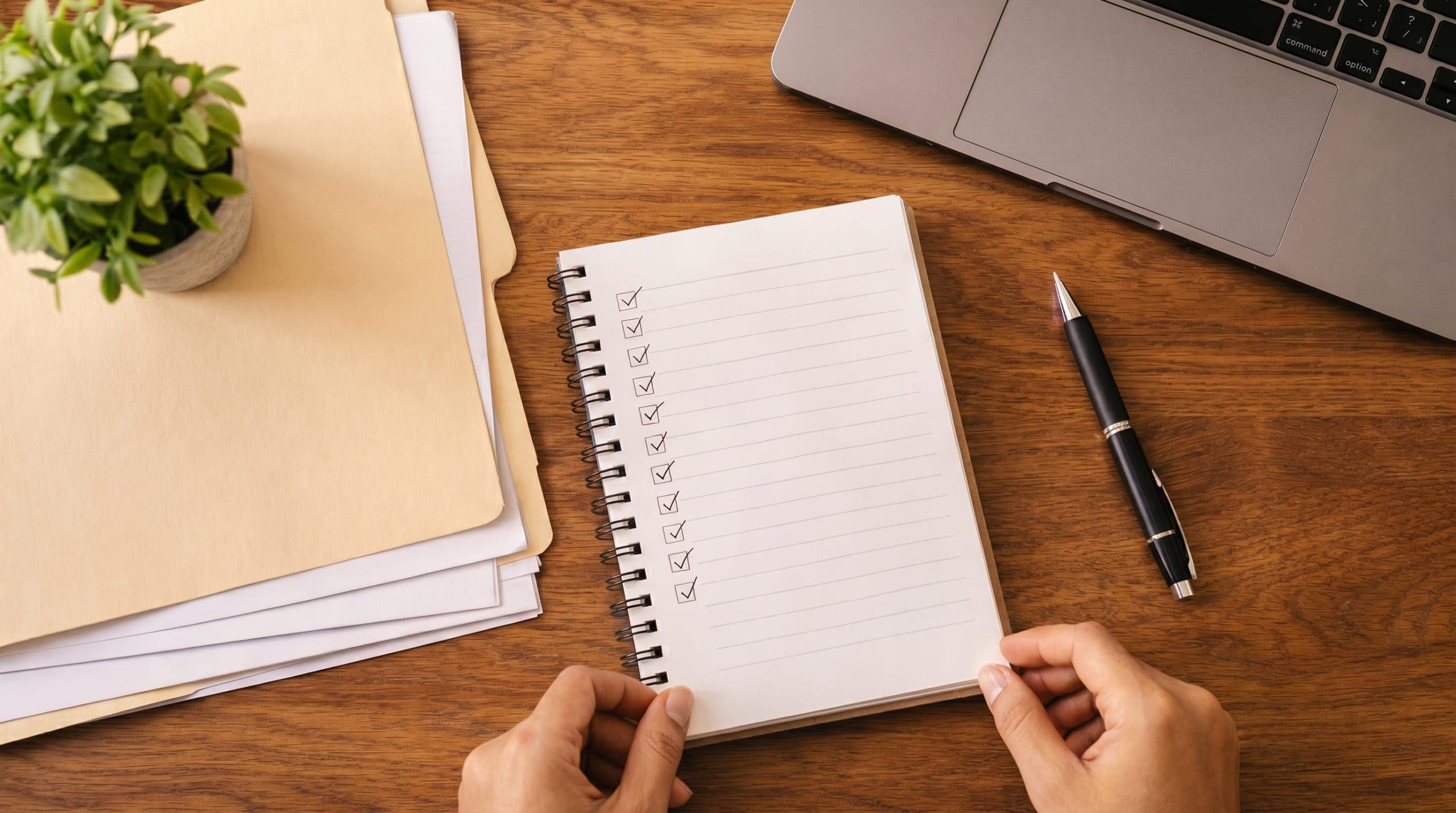 Parent and educator reviewing IEP documents together at a school meeting