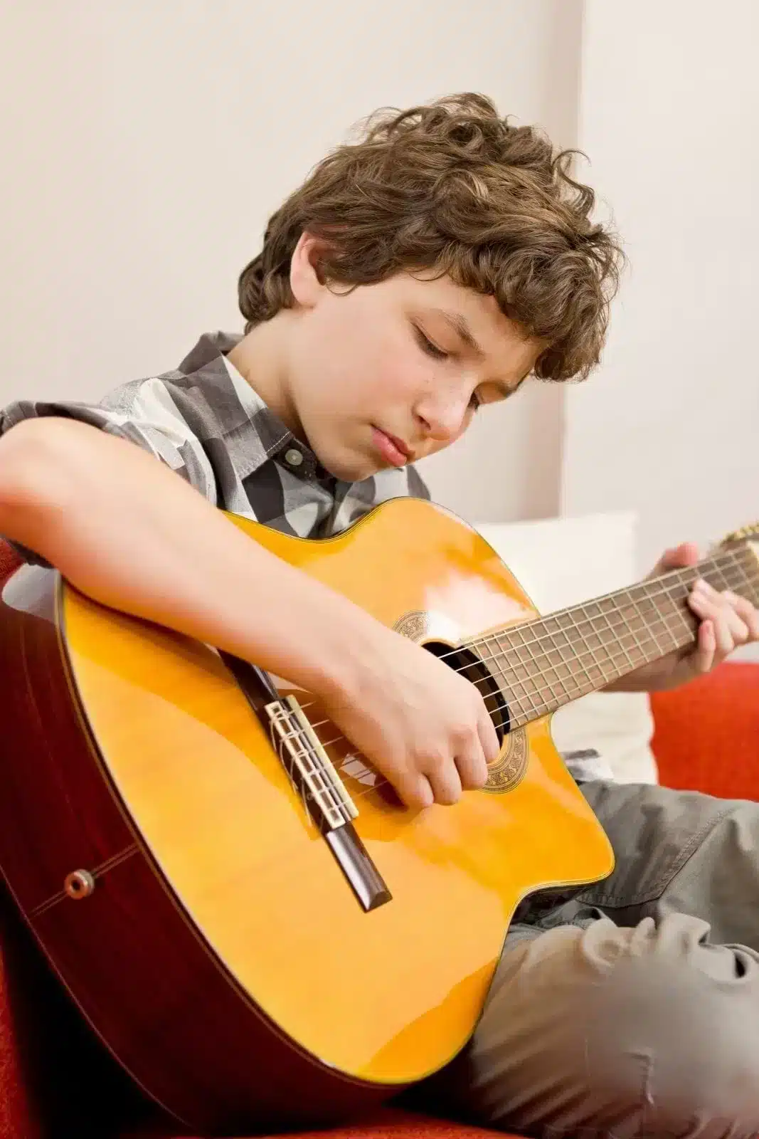 A Teenager playing guitar