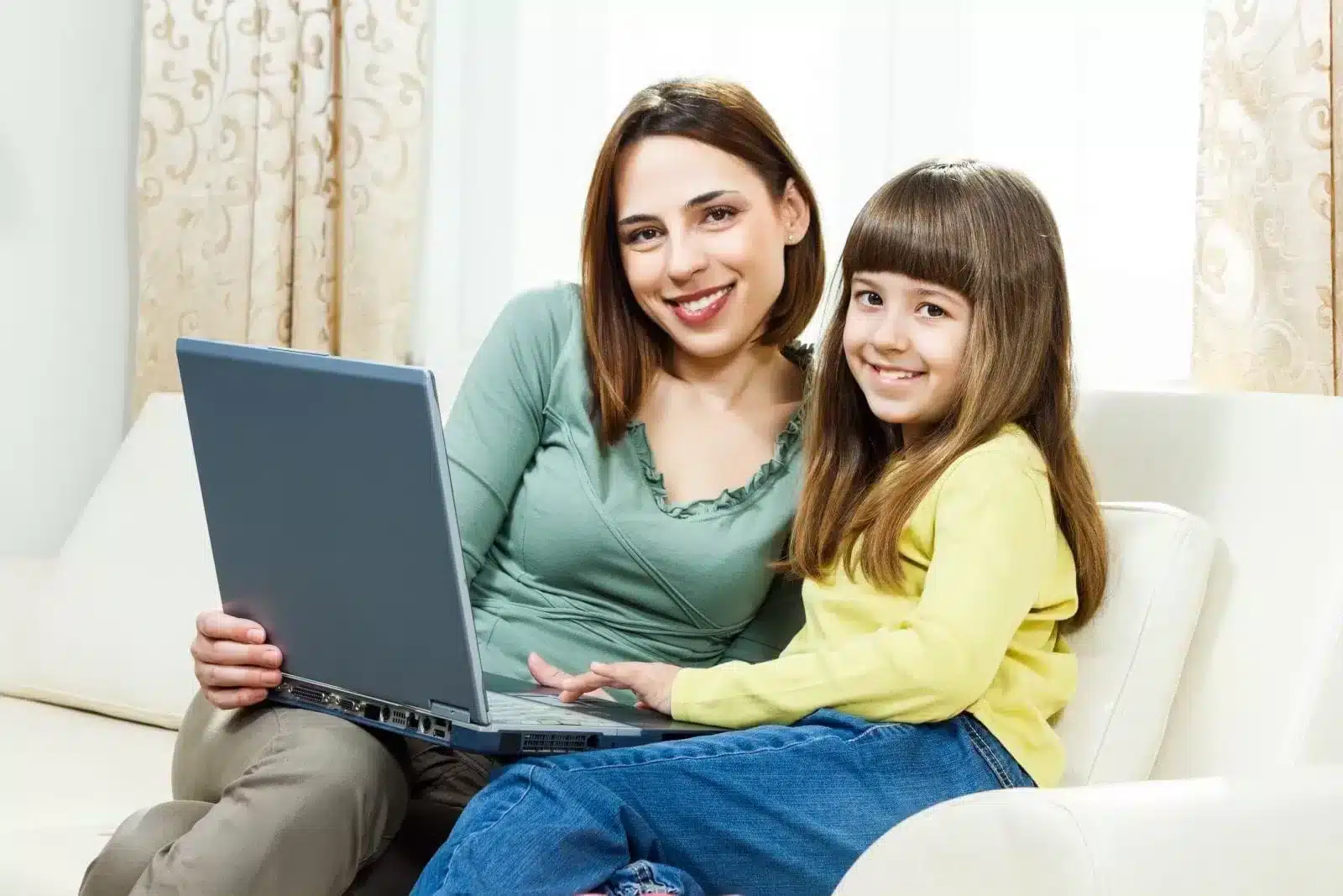 Happy-Mother-and-Daughter-with-Computer