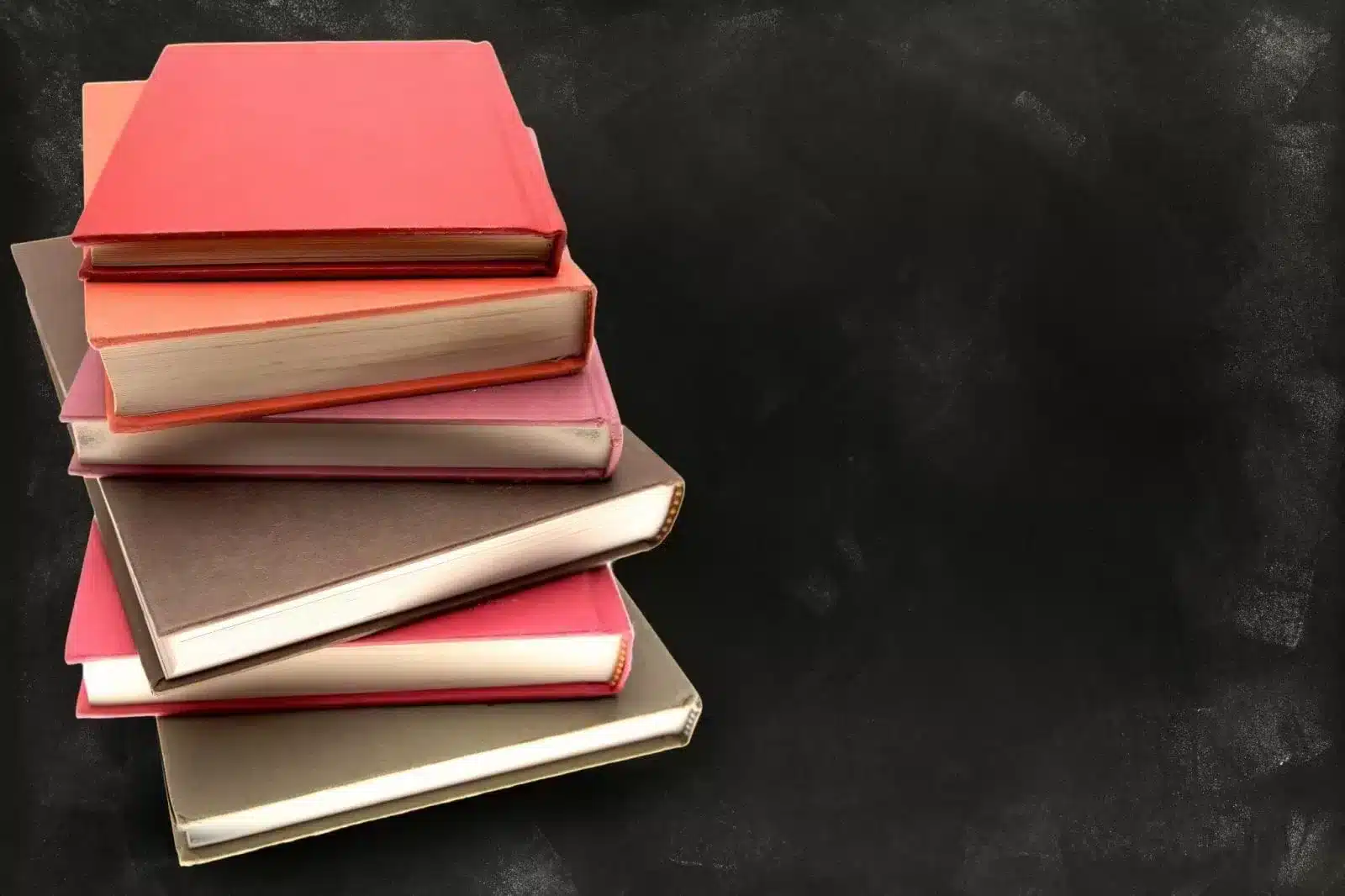 A Black background with stack of books