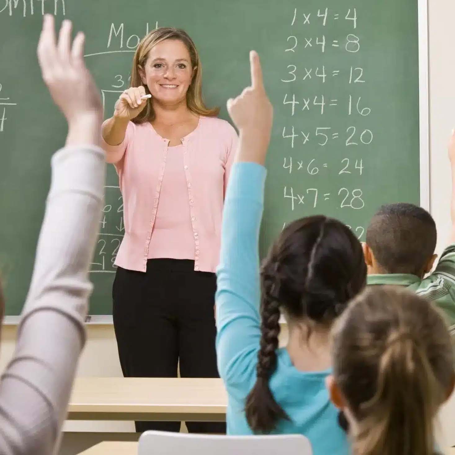 Teacher calling on a student that raised hands