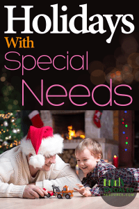 Dad with Santa hat laying on the floor playing with son in front of the Christmas tree and fireplace with text overlay Holidays with Special Needs