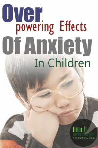 Sad young boy with glasses with text overlay "Overpowering Effects Of Anxiety In Children"