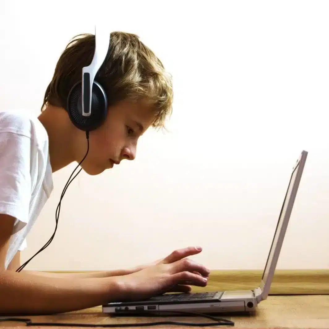Boy with laptop and Headphones