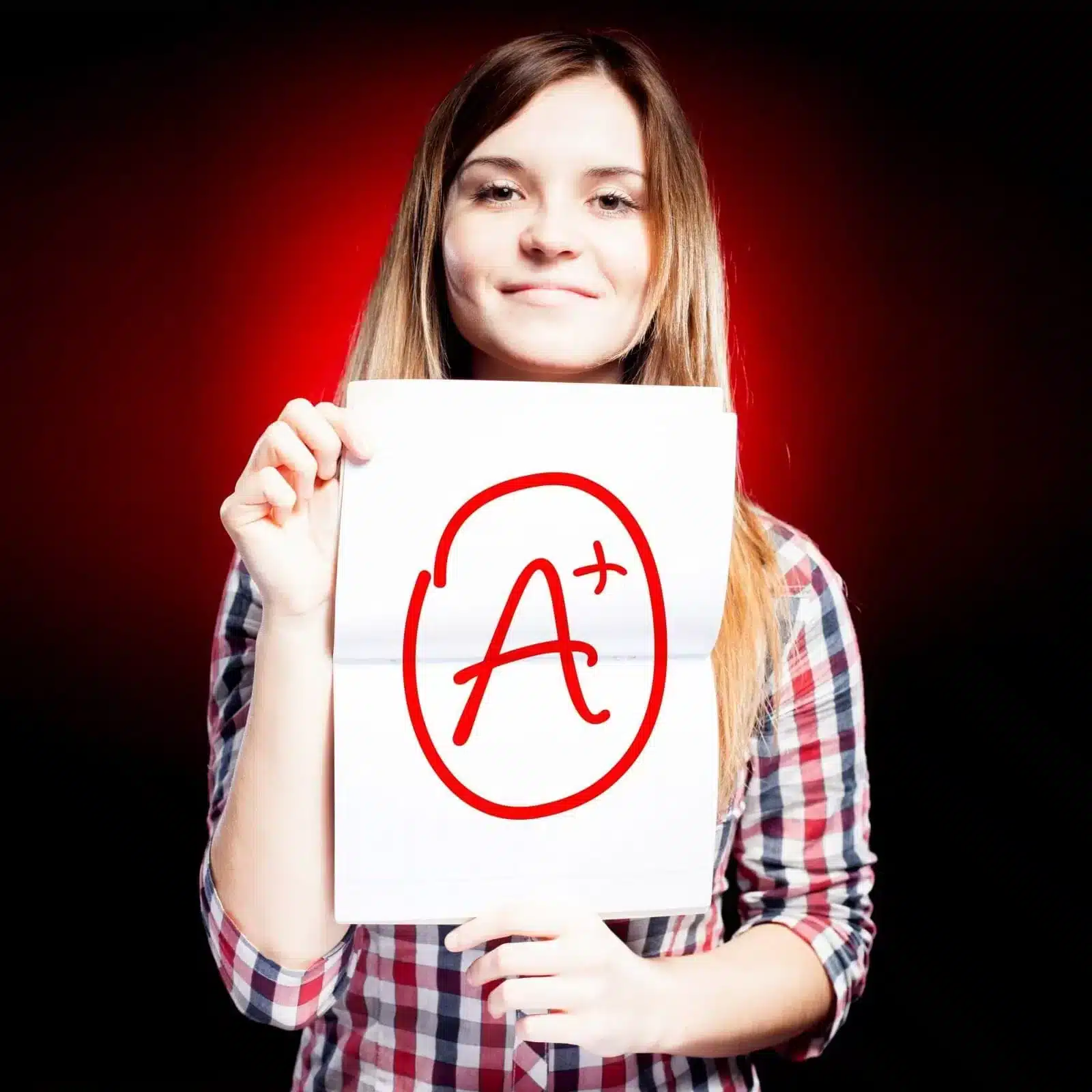 Girl holding paper with A plus sign
