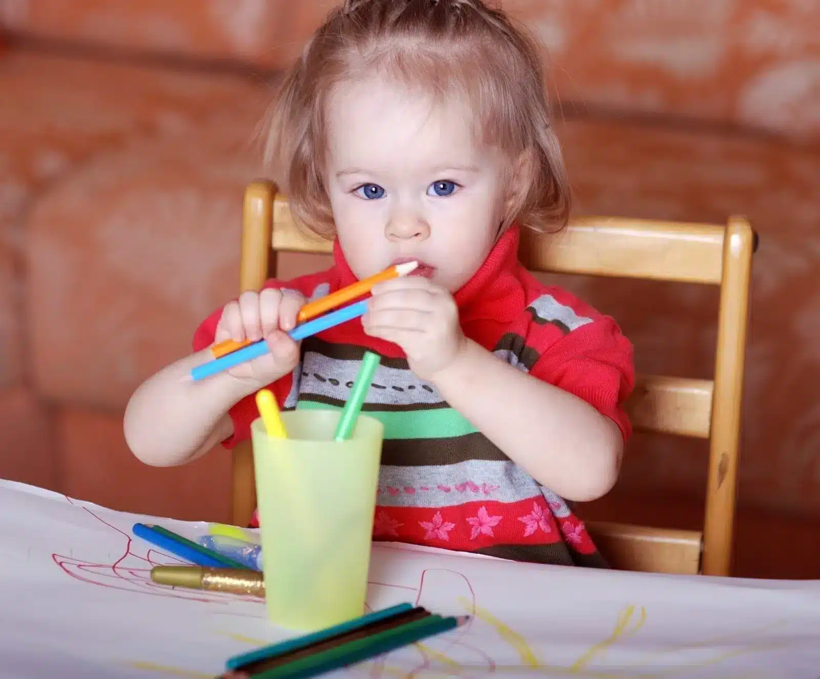Little Girl Chewing on pencils
