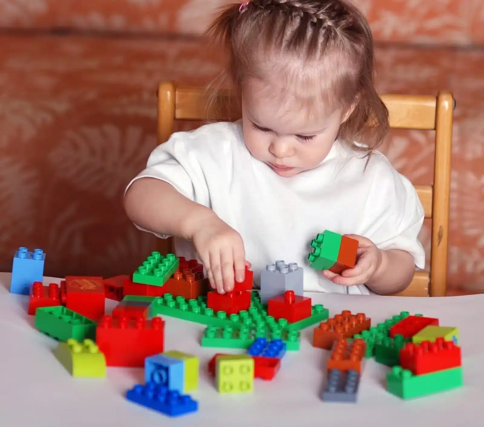 Little-Girl-Playing-with-Legos