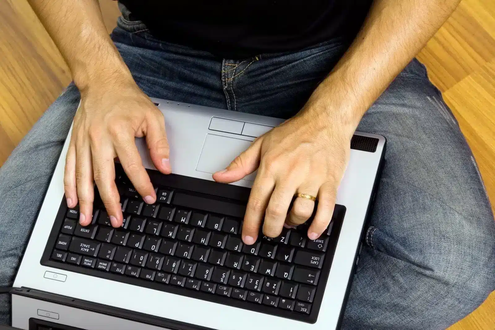 Typing on a Laptop Man Sitting