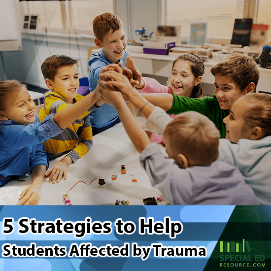 Group of students in the classroom all high fiving each other at the end of one of the 5 strategies the teacher implemented to help students affected by trauma.