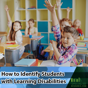 Students sitting in their seats in the classroom with their hands raised while the teacher is thinking How to Identify Students with Learning Disabilities.