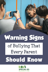 Group of boys bullying one boy at school. Read the warning signs of bullying that every parent should know. 