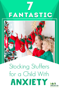 Two young girls standing in front of their Christmas stockings excited about getting the stocking stuffers for a child with anxiety their parents got them.