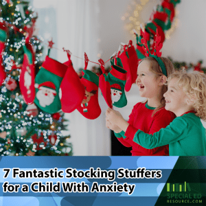 Two young girls standing in front of their Christmas stockings excited about getting the stocking stuffers for a child with anxiety their parents got them.