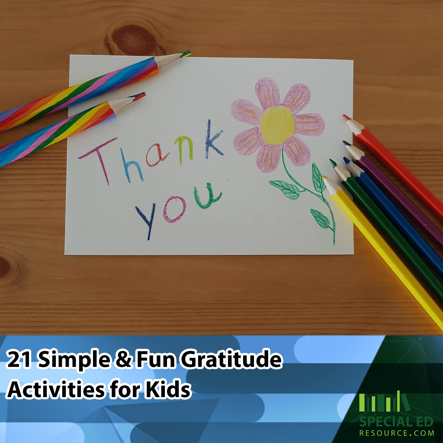 A handmade card with the words thank you written on it sitting on a child’s desk with colored pencils. It is one of the 21 gratitude activities for kids.