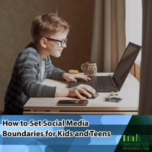 A young boy with glasses focused on using a laptop at a desk, with a mug and smartphone nearby, using the social media boundaries for kids his parents established from the tips in this blog post by https://specialedresource.com/
